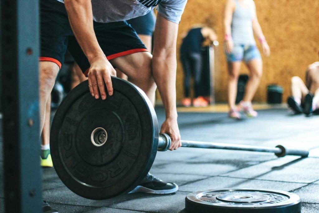 Best Gyms in Orchha (2025) | Fitness Clubs, Timings, Reviews & Facilities 6 Focused weightlifting session in a gym with diverse athletes participating indoors - best gyms in orchha