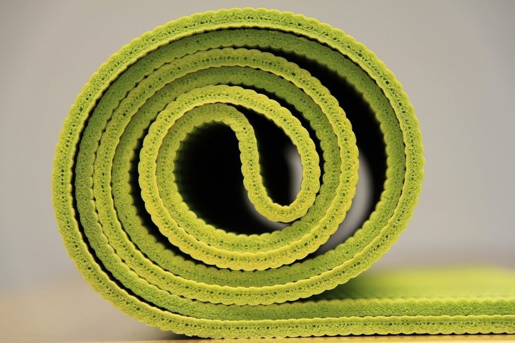 Green-colored-rolled-yoga-mat