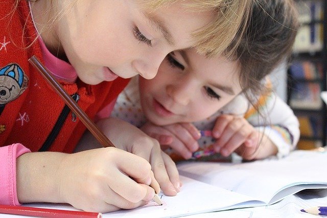 kids-writting-on-paper-with-pencil-self-study