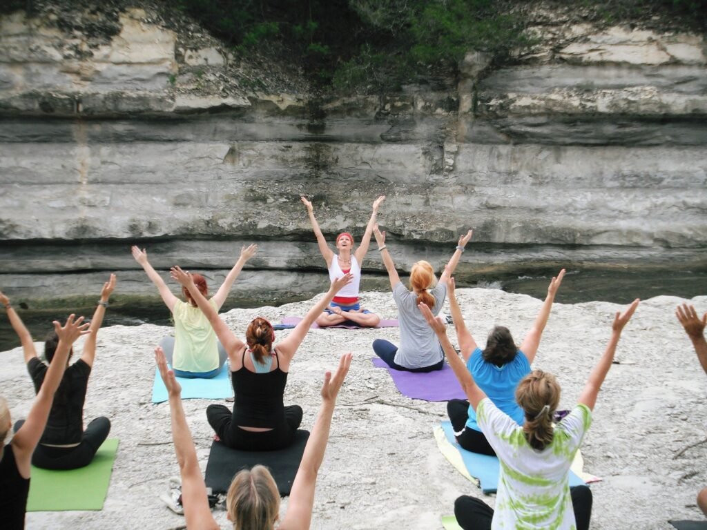women-yoga-class-practicing-in-nature